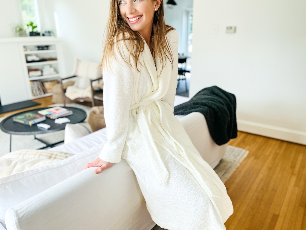 A woman wearing a white robe