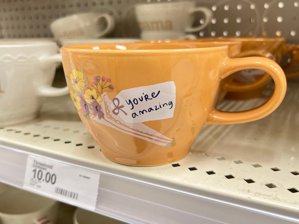 orange you're amazing mug on shelf