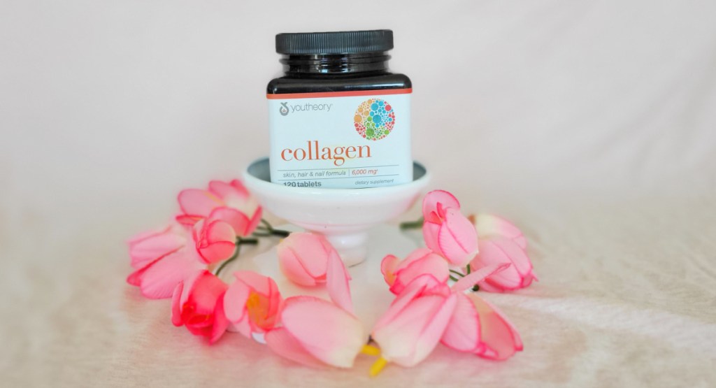 collagen bottle in pile of flowers