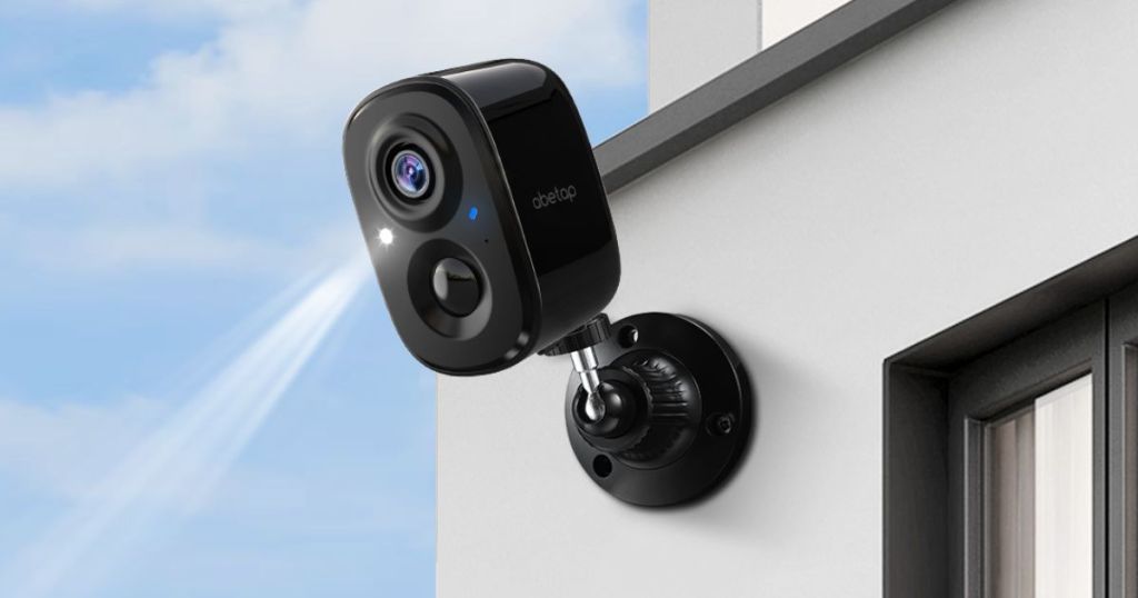 Abetap black security camera attatched to side of house