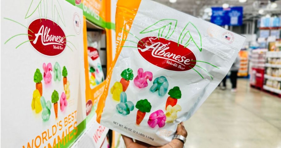 A person holding a huge bag of Albanese Easter Gummies at Costco