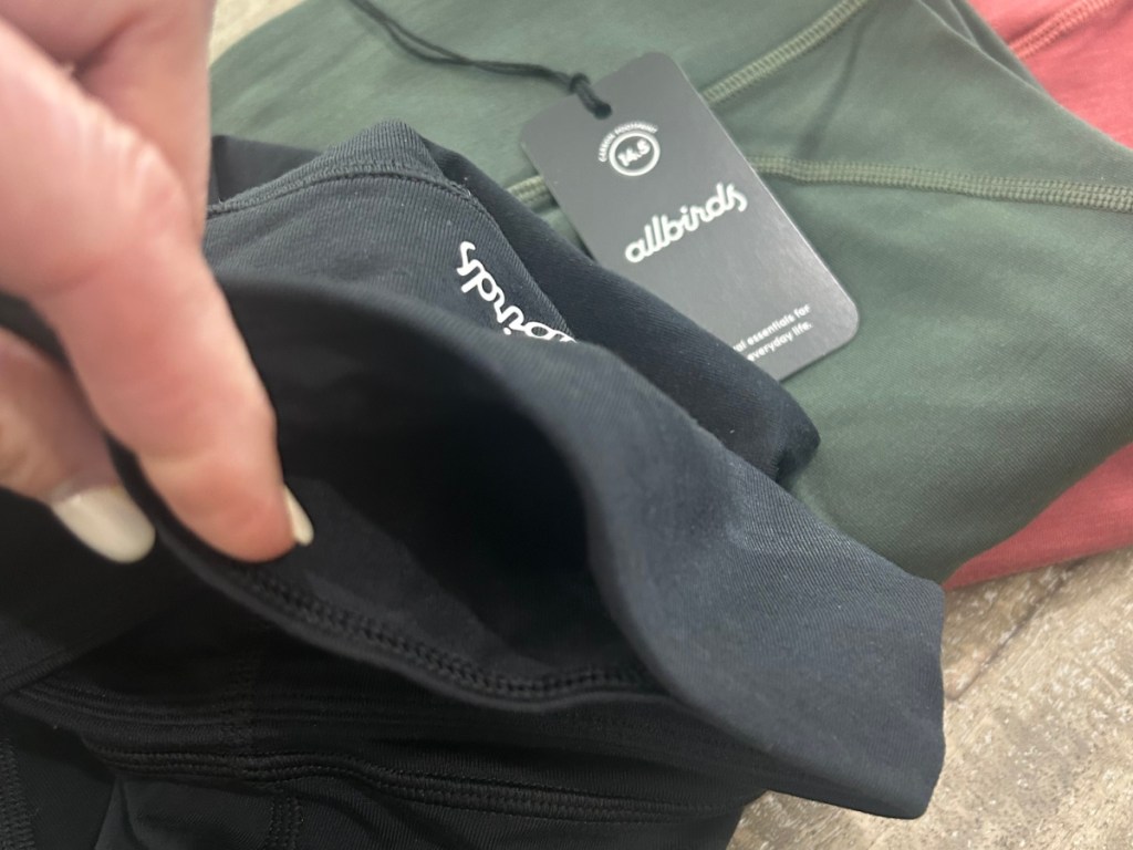 phone pocket in allbirds black leggings