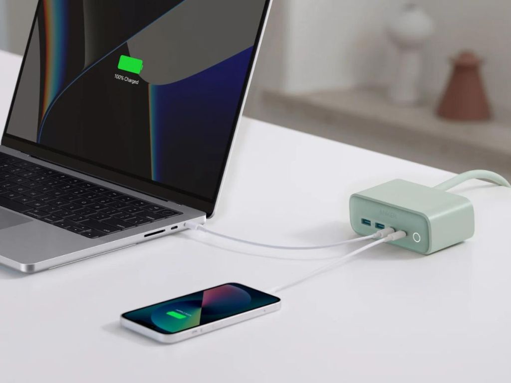 Anker Charging Station with laptop and phone plugged into it