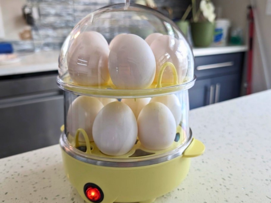 double tiered bella egg cooker in yellow on countertop