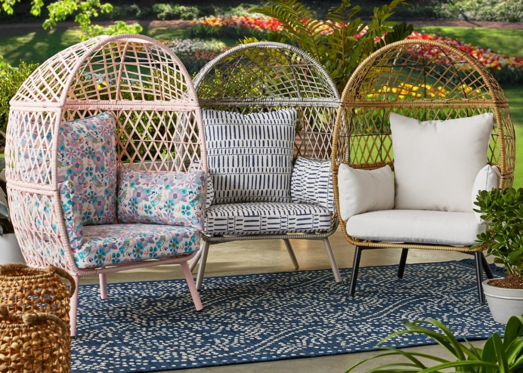 Three kids wicker egg chairs on a patio