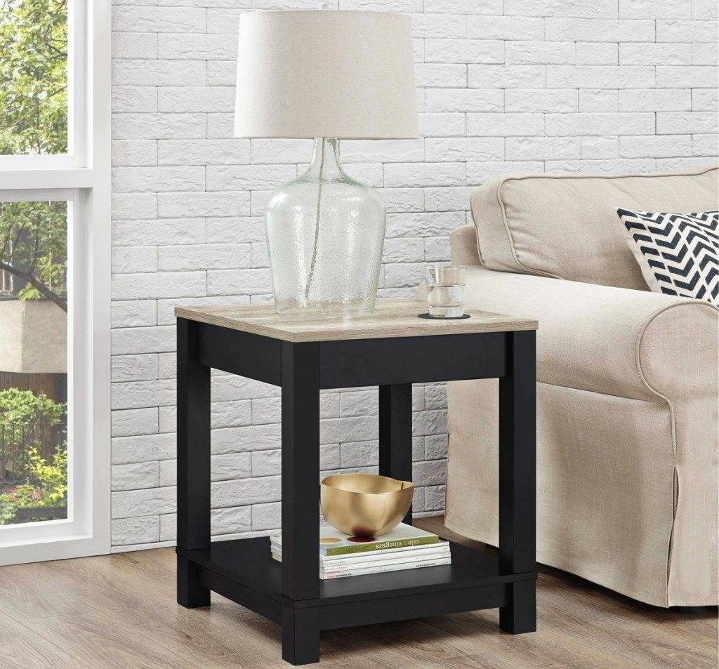 black end table with lamp on top