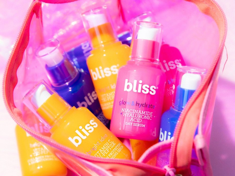 colorful bliss serums in pink makeup bag