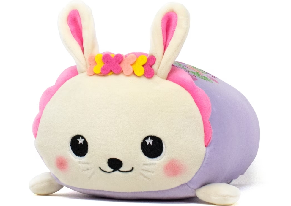 Plush toy that looks like a bunny with a pink headband on