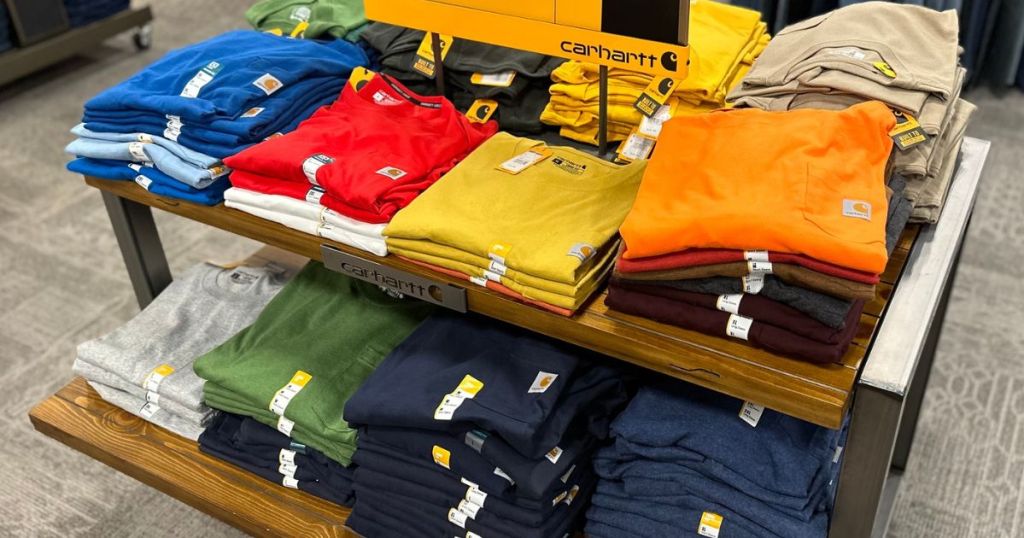 display in store of Carhartt pocket tees folded on a table