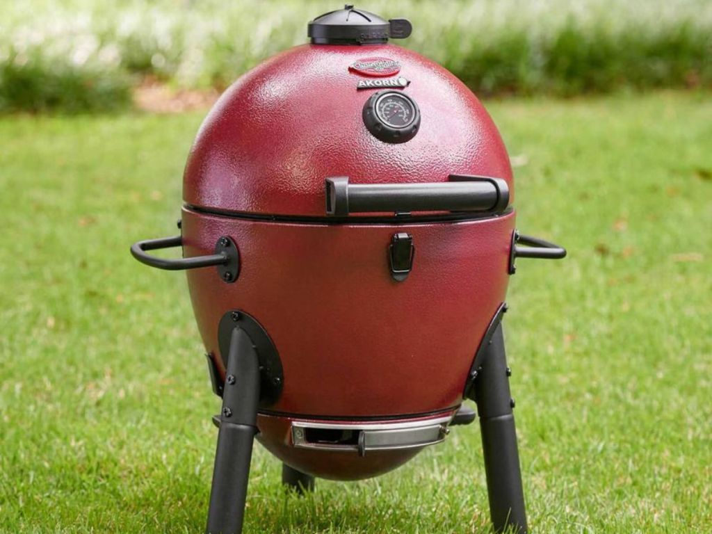 Mini Red Charg-Griller Acorn Kamado Grill in grass