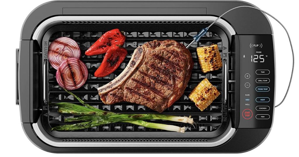 steak and BBQ foods grilling on Indoor Grill with temperature probe in steak