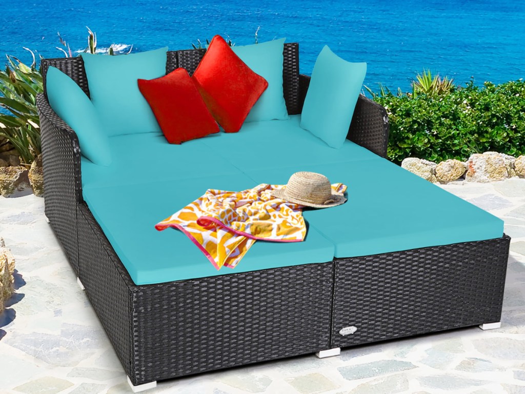 Costway Outdoor Rattan Daybed with blue cushions