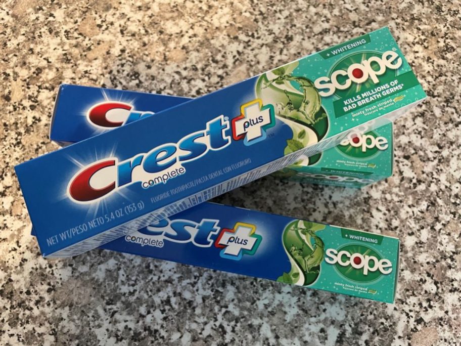Three boxes of Crest toothpaste
