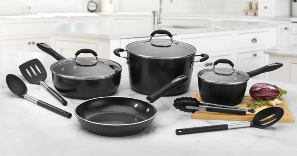 black nonstick cookware set and utensils on kitchen counter