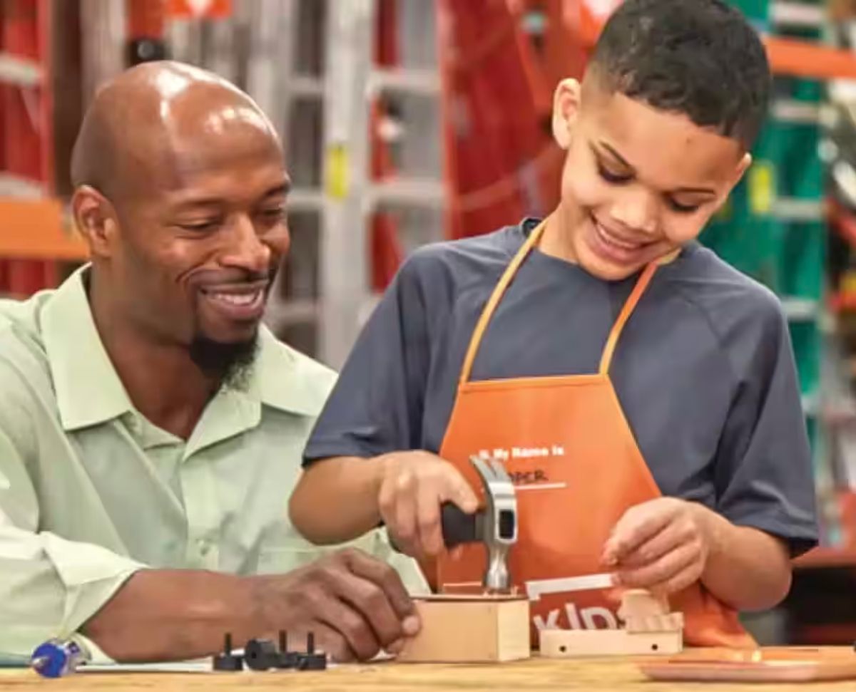 Dad and son working on a workshop project at home depot