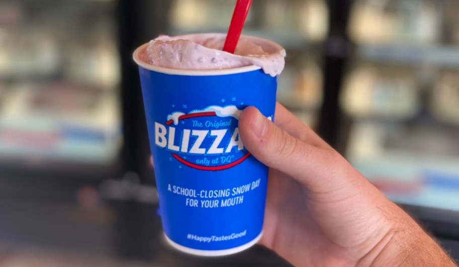 Man holding a Dairy Queen Cotton Candy Blizzard which may be returning for 2023