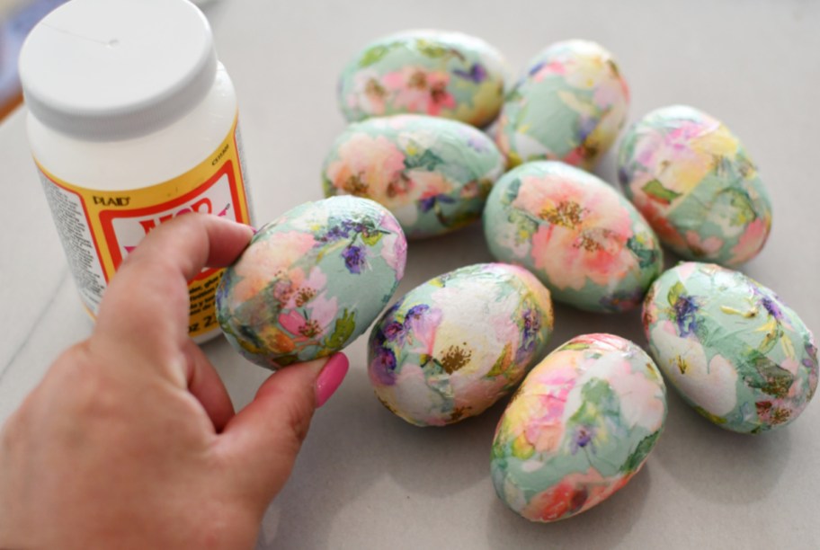 Decoupage Easter Eggs next to a bottle of mod podge