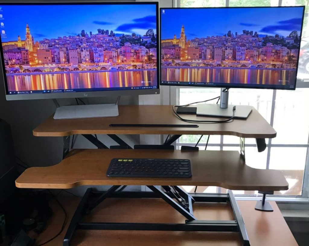 Desk Converter Wooden Brown with 2 monitors set up on it and a keyboard