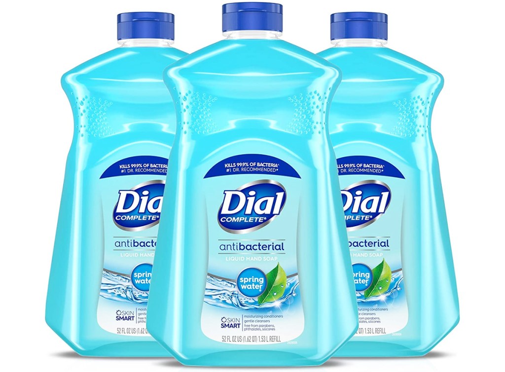 three large blue bottles of dial hand soap