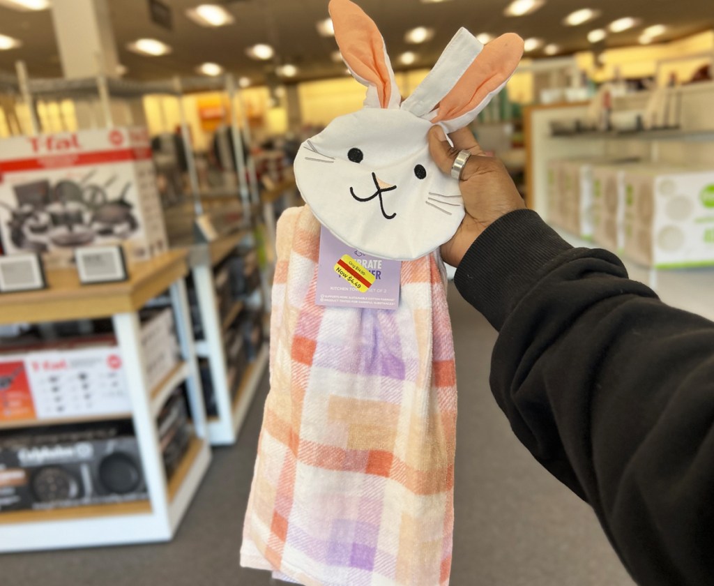 hand holding up easter bunny kitchen towels