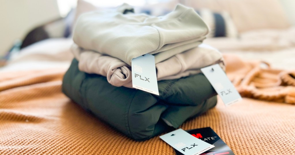 kohl's flx clothing folded in pile with tags