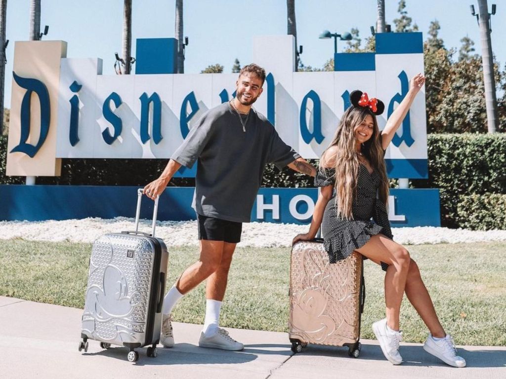 Couple at Disneyland with Disney Luggage