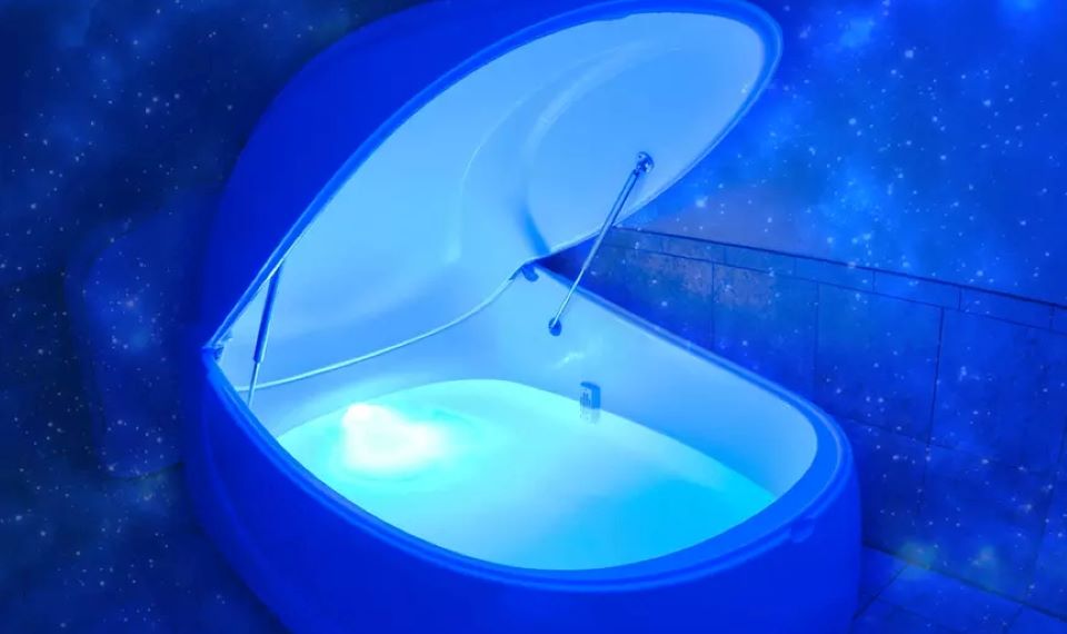Float tank with the lid open and a starry background
