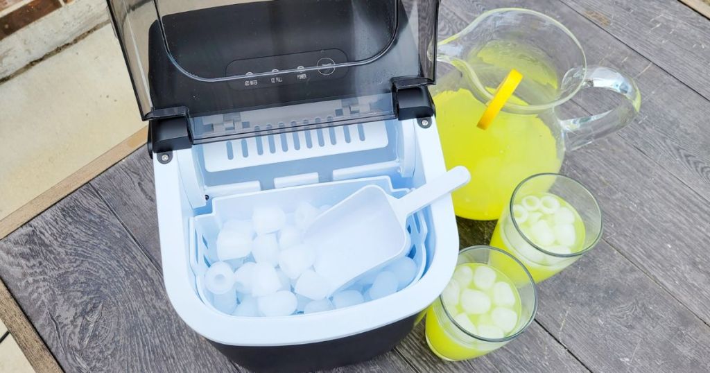 top view of Free Village Ice Maker with open basket displaying ice cubes.