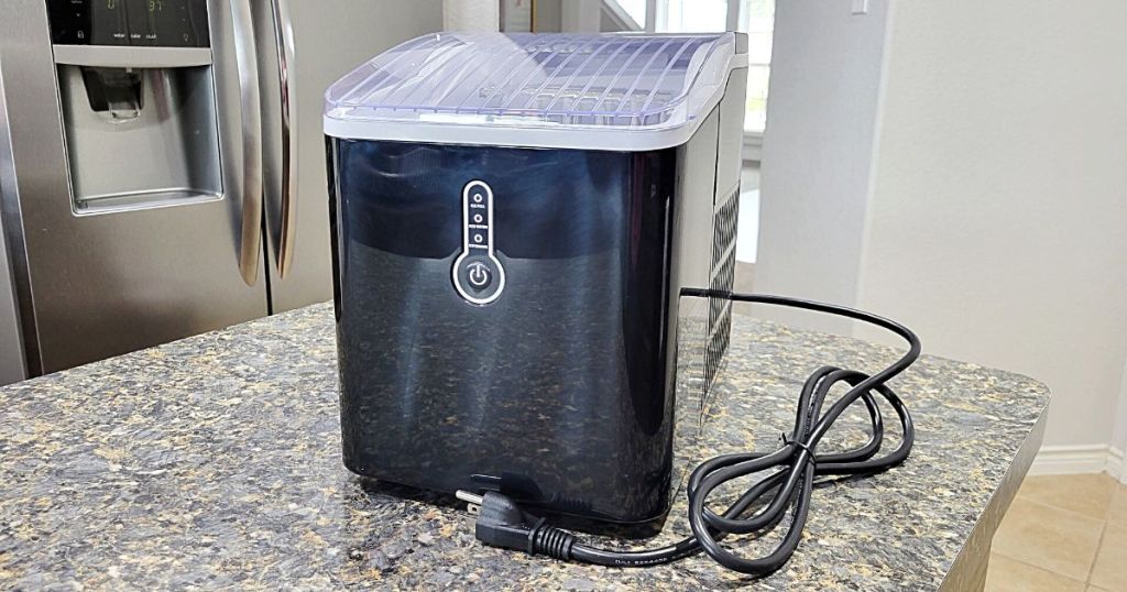 Portable Countertop Ice Maker placed on marble top counter