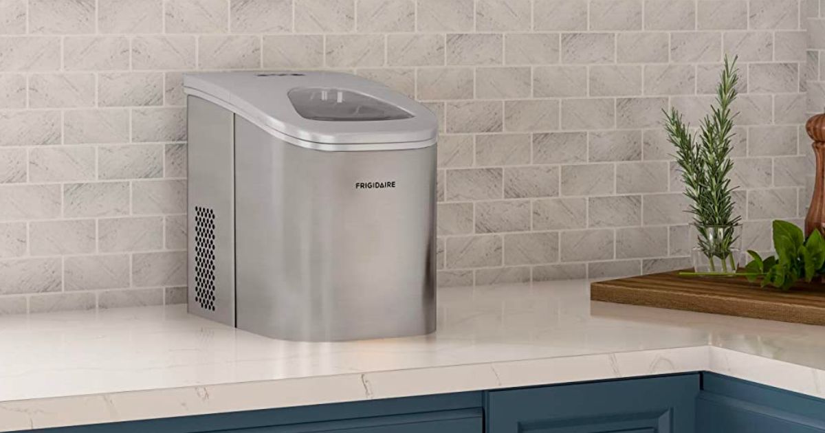 Frigidaire 26lb ice maker sitting on a kitchen counter 