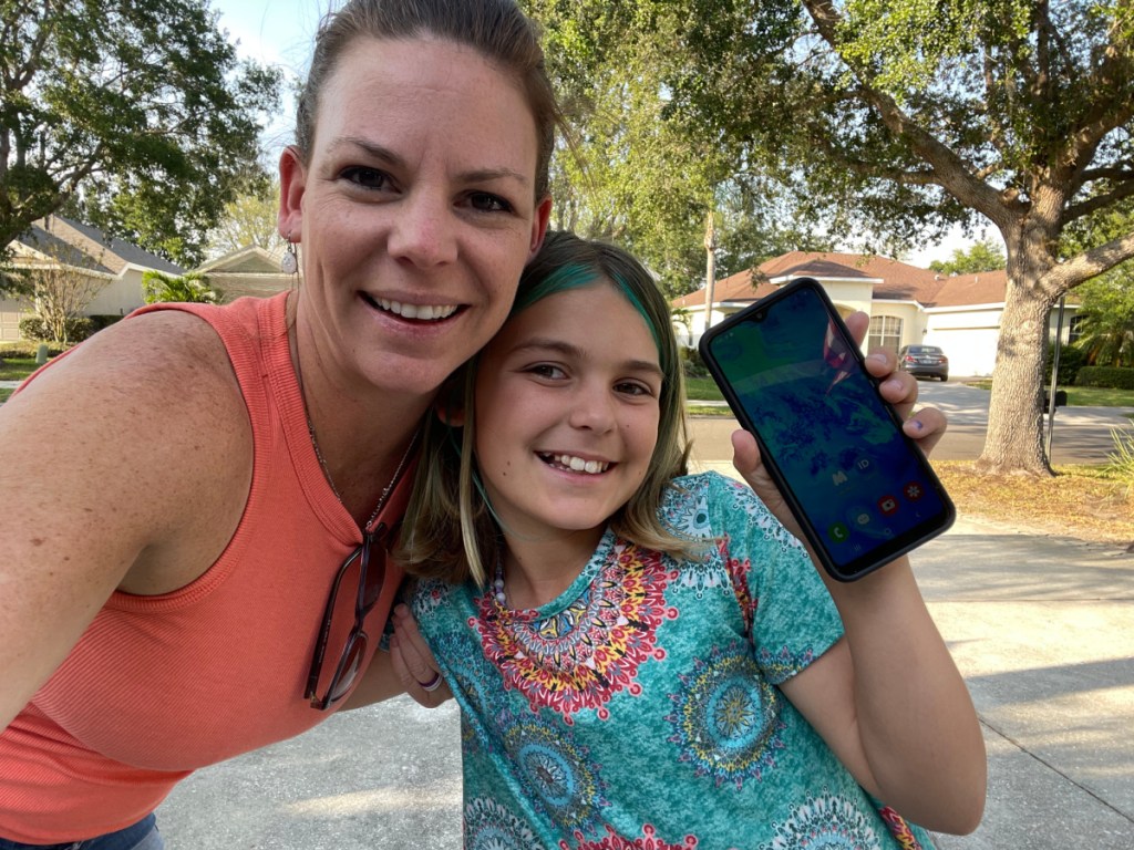 mom and daughter posing with the Gabb phone for kids