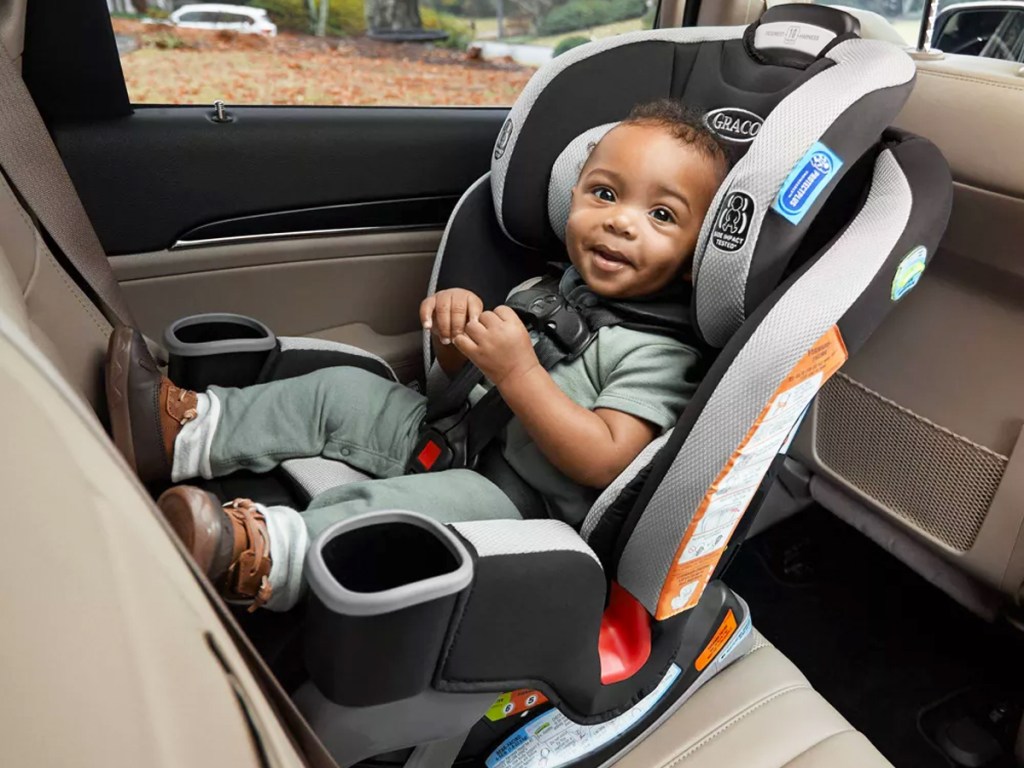 baby boy in Graco car seat