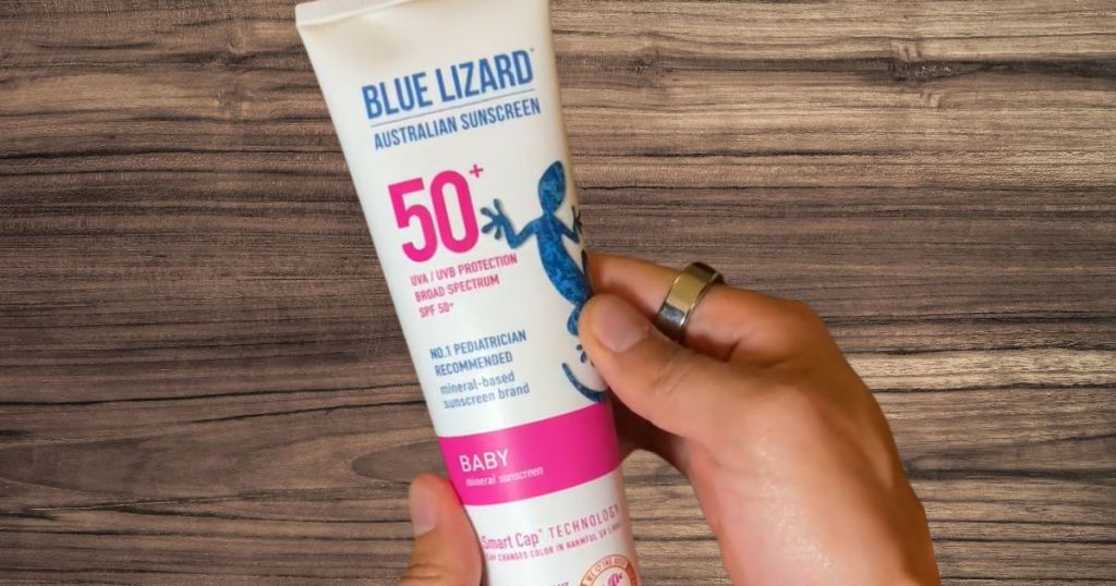 hand holding tube of Blue Lizard baby sunscreen