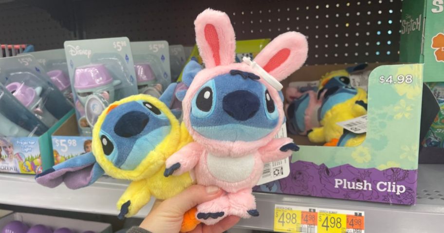 hand holding Disney plush Stitch in Easter outfits