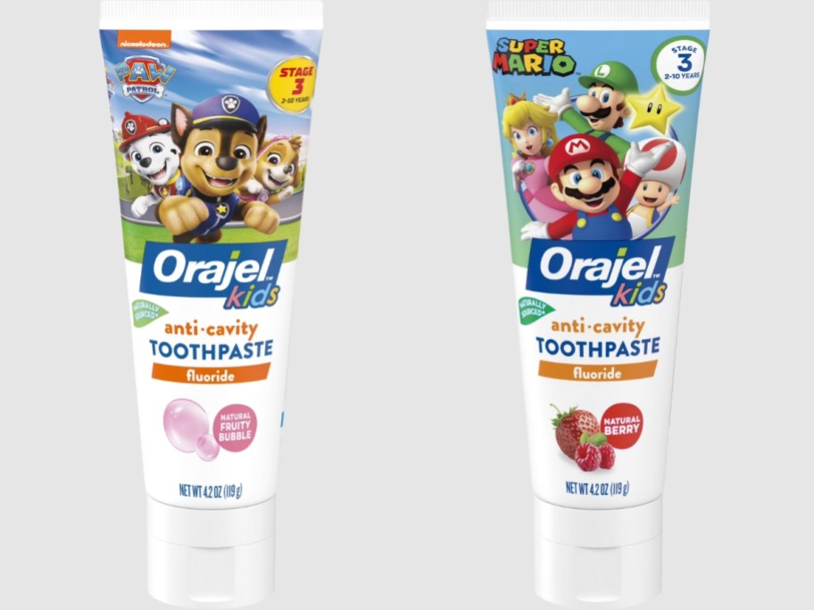 two tubes of Orajel Kids Toothpaste - Paw Patrol and Super Mario