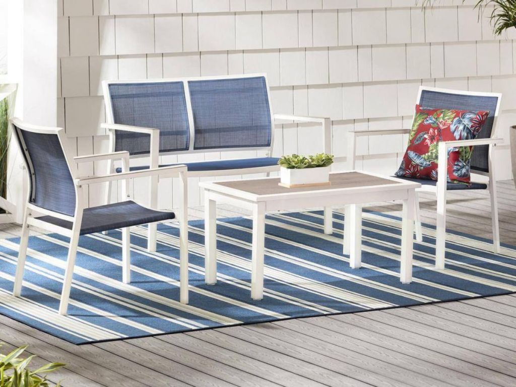 Hampton Bay 4-Piece Patio Set with two chairs, a table and a loveseat