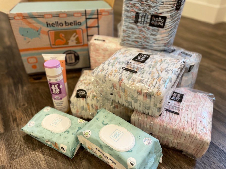 packs of hello bello diapers and wipes on floor