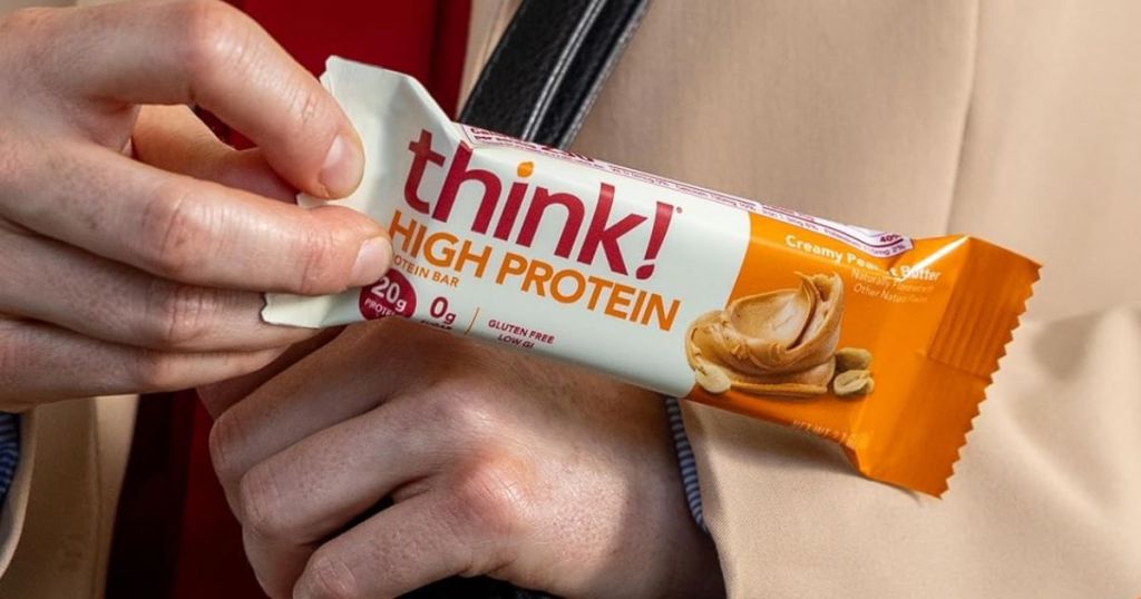 think! Protein Bars Creamy Peanut Butter in person's hand