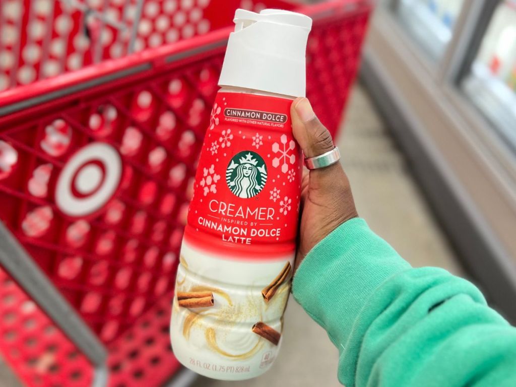 Starbucks Cinnamon Dolce Coffee Creamer in person's hand at Target
