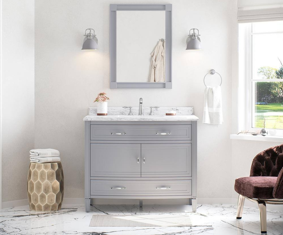 Bathroom with grey vanity and mirror