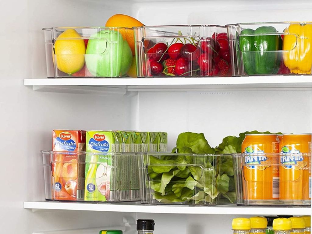 clear bins in refrigerator filled with fuits and veggies and drinks