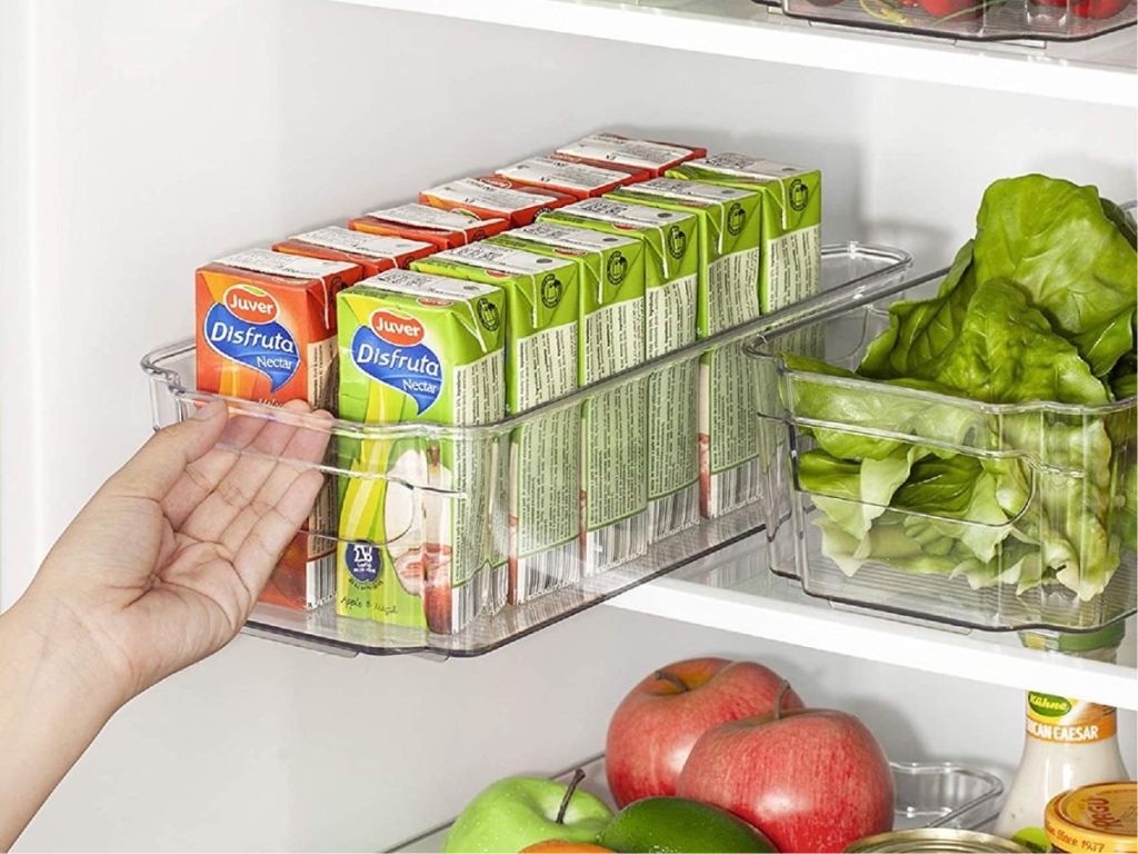 clear bins in refrigerator holding veggies and drinks