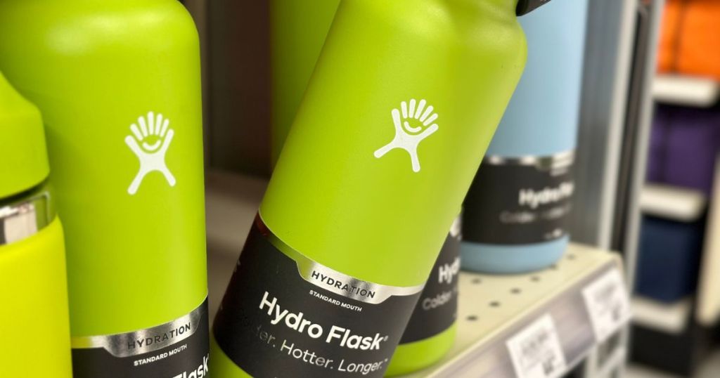 Green Hydro Flask Bottle being tipped forward on a store shelf