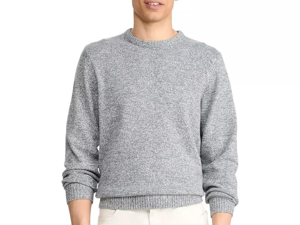 A man wearing an Izod pullover sweater