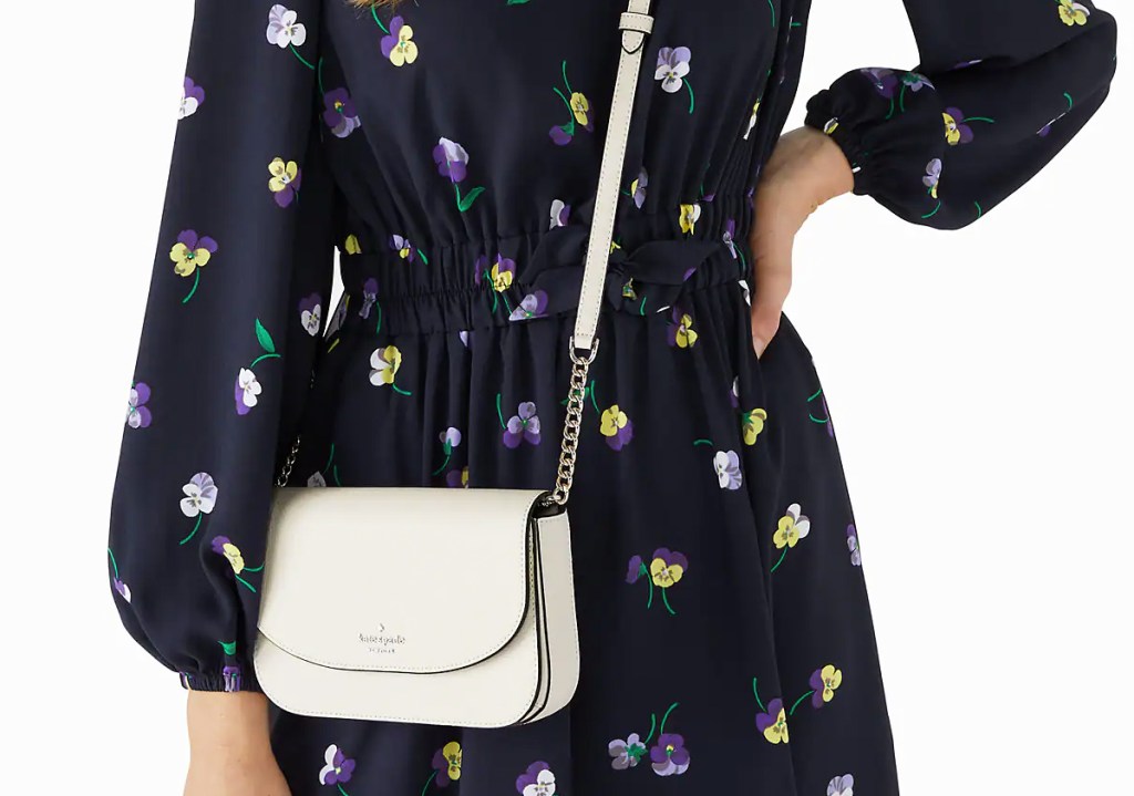 woman with white kate spade crossbody bag