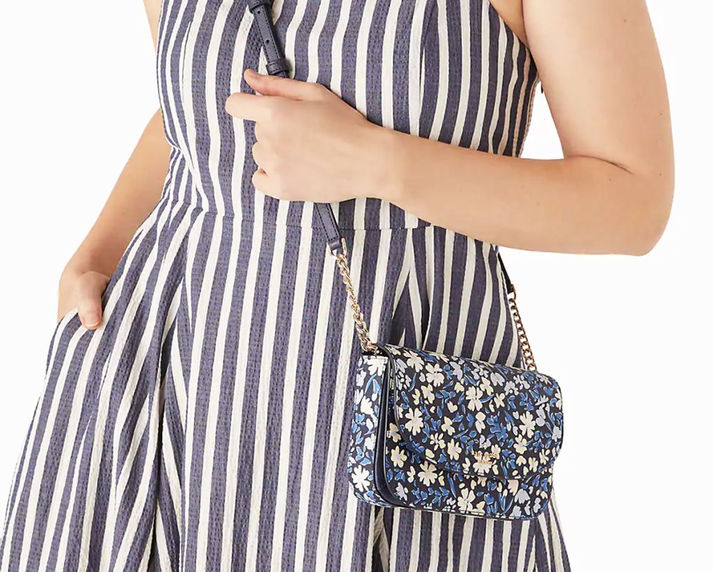 woman with blue floral print crossbody