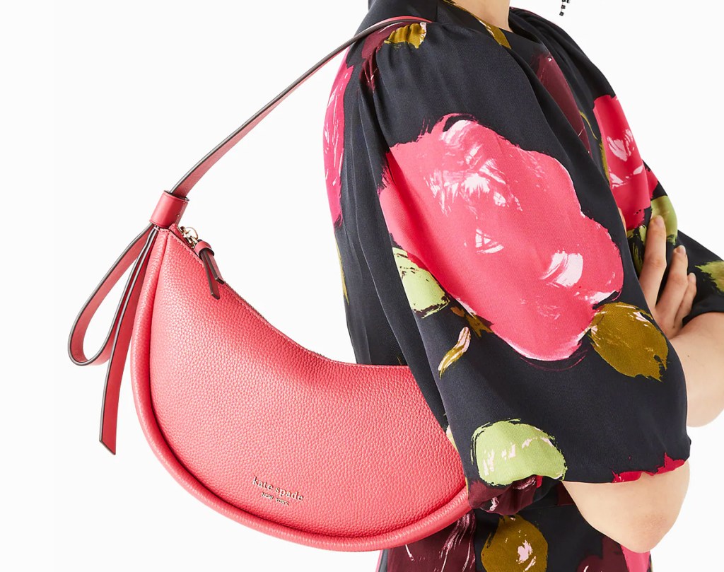 woman with pink shoulder bag