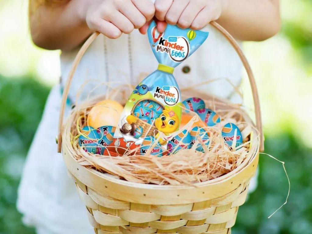 kid holding Easter basket with Kinder Mini Eggs in basket