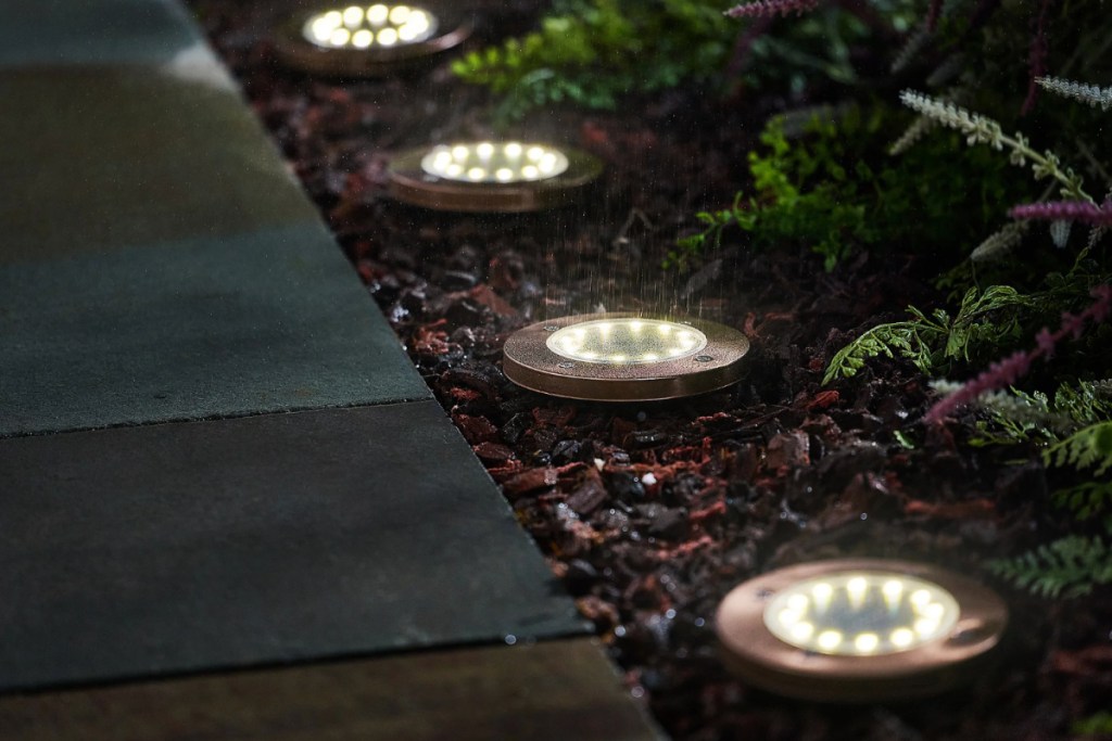 solar disc lights in a row on the lawn