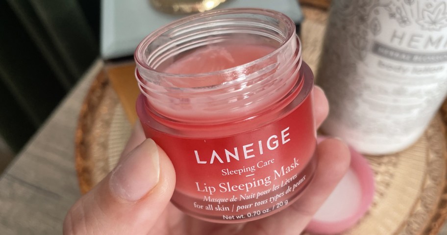 hand holding pink Laneige Sleep Lip Mask